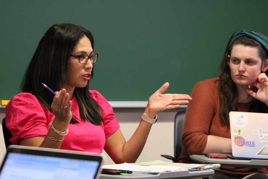 two female students talking during world language class