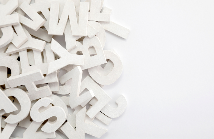 Monochromatic cut out of letters pilled up