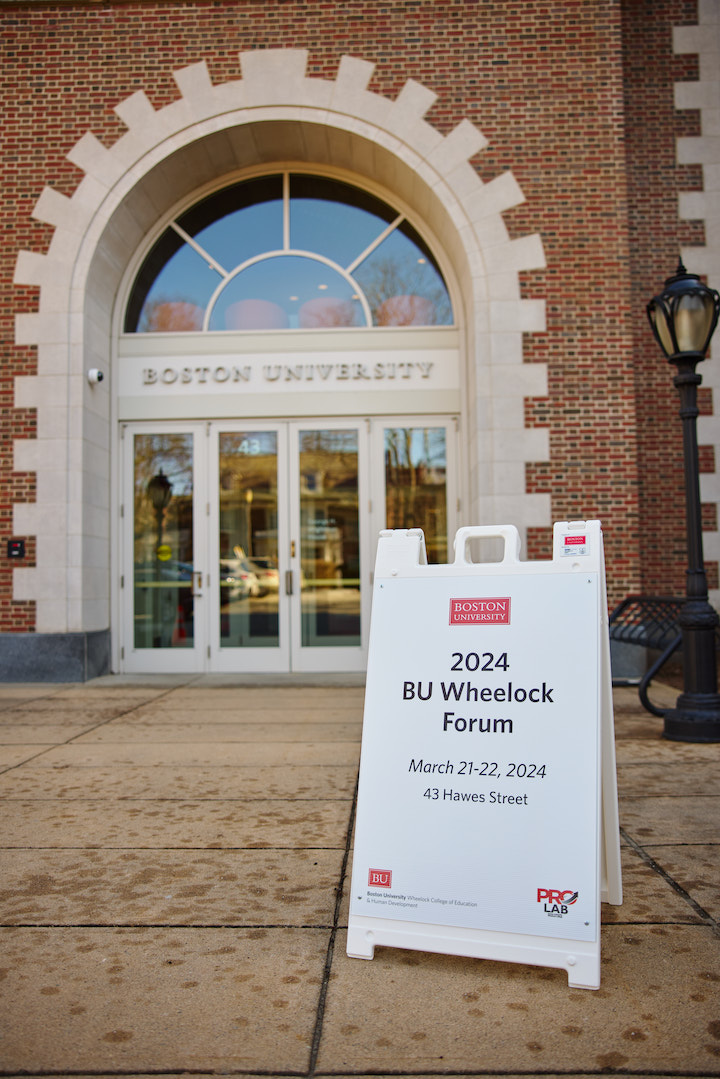 sign outside of BU building welcoming participants to the BU Wheelock Forum