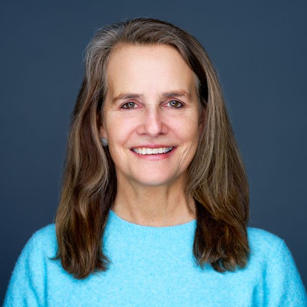 Shows Sandy Potter, who is wearing a light blue top
