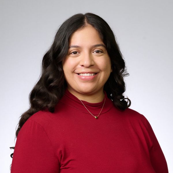 Headshot of Adine Deleon