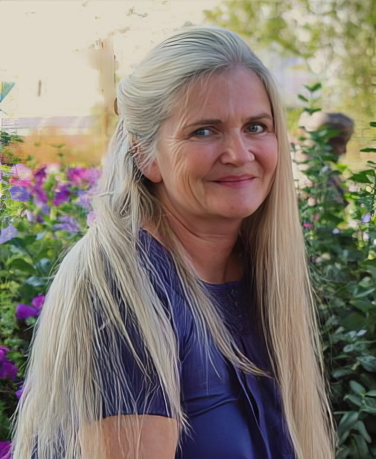 Shows Debbie Lane sitting outdoors