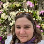 image of Heather Barrett in front of a floral display