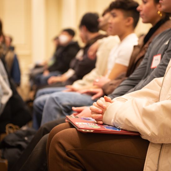 Students sit attentively.